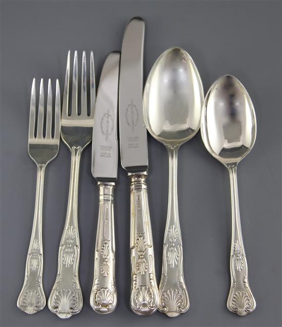 A 1960s/1970s canteen of silver double struck Kings pattern cutlery for twelve in a mahogany single drawer free standing cabinet,